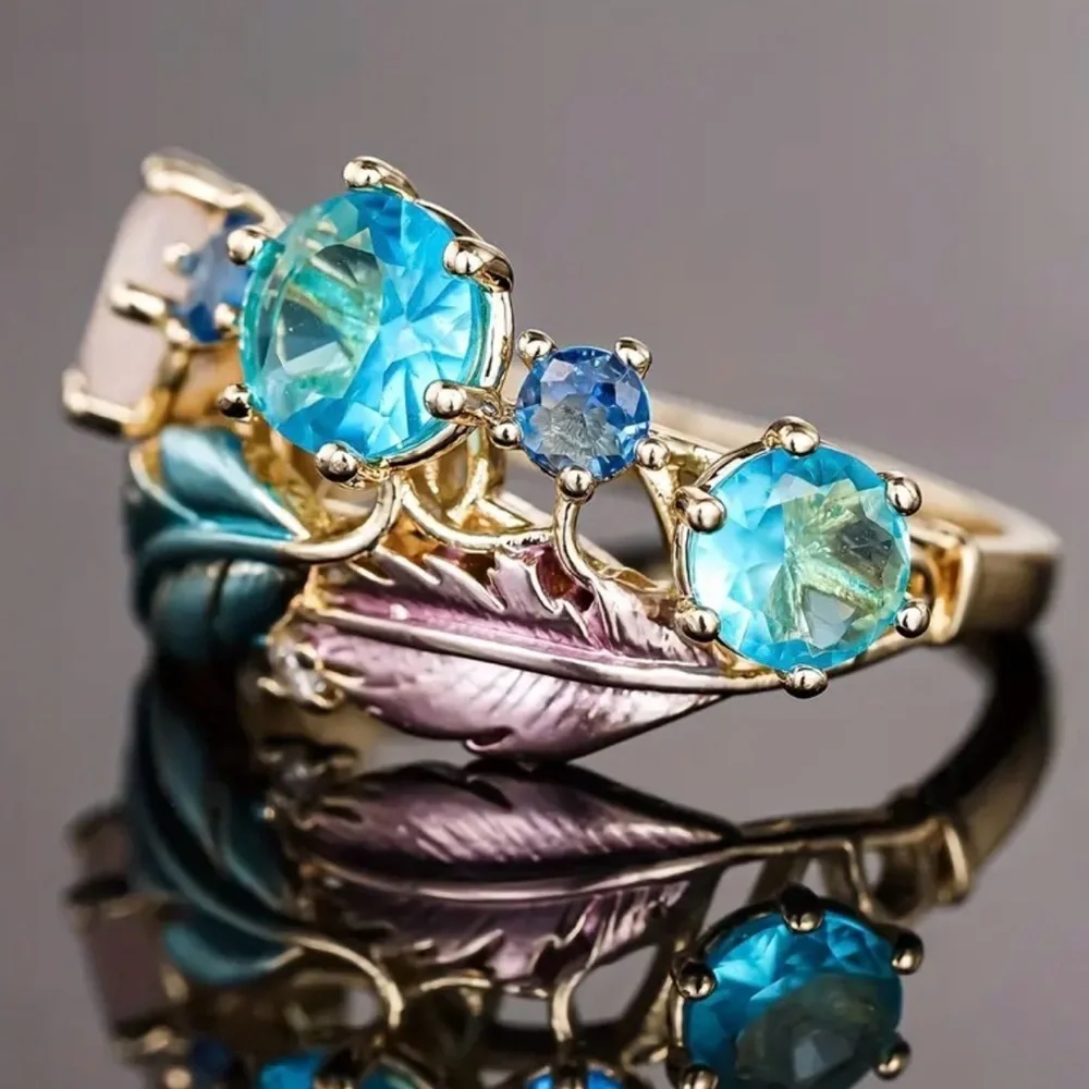 Gold Ring With Blue & Pink Accents.